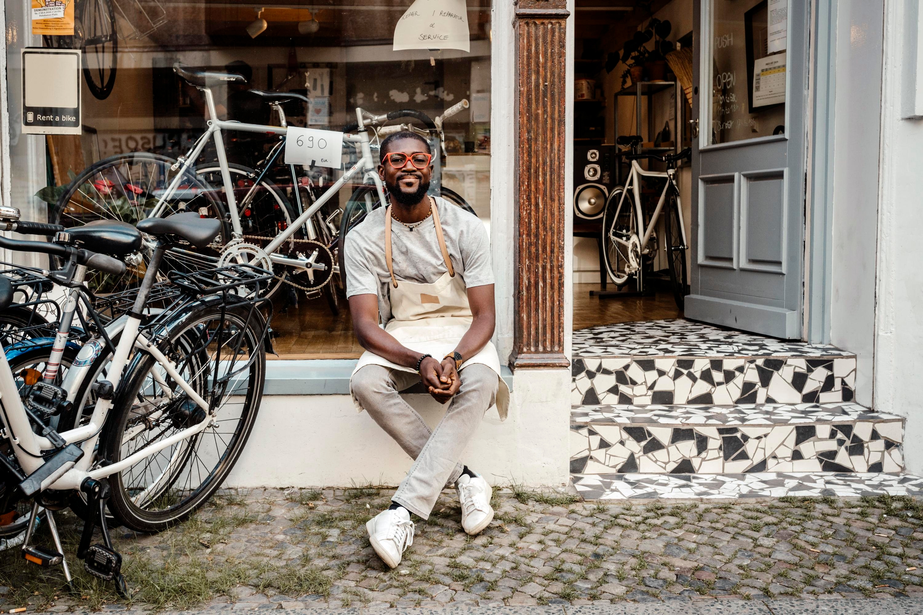 Business owner outside his bike shop