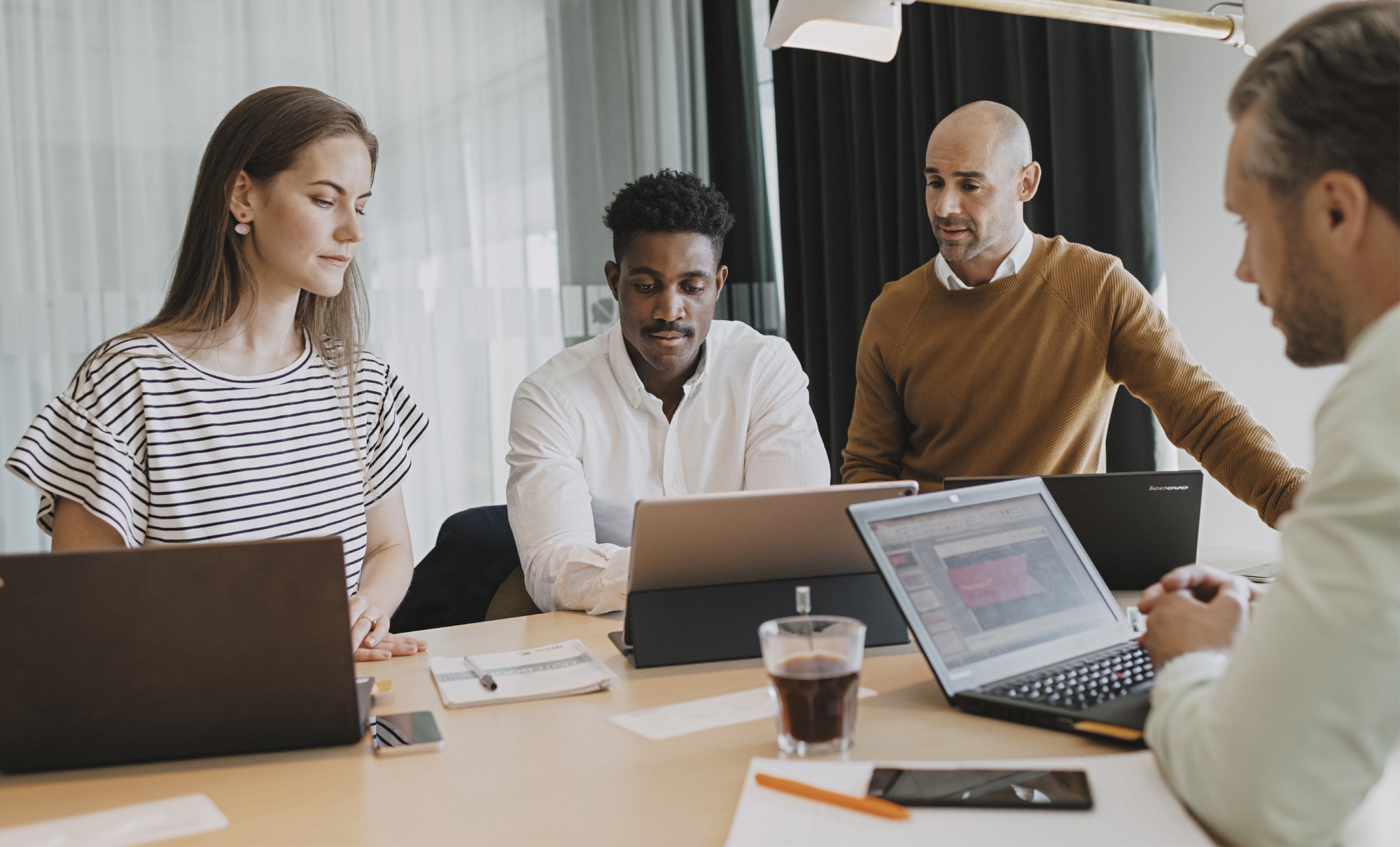 Colleagues looking at a computer